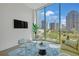 Stylish living room with floor-to-ceiling windows and a stunning city view at 40 12Th Ne St # 903, Atlanta, GA 30309