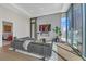 Elegant living room boasts a cozy fireplace, stylish decor, and city skyline views at 40 12Th Ne St # 903, Atlanta, GA 30309