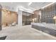 Modern lobby featuring a marble reception desk, decorative lighting, and stylish seating at 40 12Th Ne St # 903, Atlanta, GA 30309