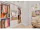 Spacious walk-in closet with custom shelving and dressing area with a mirror at 40 12Th Ne St # 903, Atlanta, GA 30309