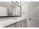 Bathroom featuring a modern vanity, countertop, and framed mirror at 501 Blackberry Ln, Canton, GA 30115