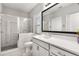 Modern bathroom with glass shower, white cabinets, and quartz countertop at 501 Blackberry Ln, Canton, GA 30115