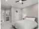 Comfortable bedroom features a ceiling fan, carpet, and ensuite bath access at 501 Blackberry Ln, Canton, GA 30115