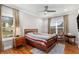 Bedroom with natural light, neutral walls, and wood furniture at 501 Blackberry Ln, Canton, GA 30115