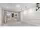 Versatile bonus room with neutral carpet, wainscoting, and natural light at 501 Blackberry Ln, Canton, GA 30115