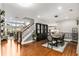 Open-concept dining area features modern decor, staircase, and seamless flow to the living spaces and kitchen at 501 Blackberry Ln, Canton, GA 30115