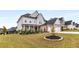 Well-maintained two-story home boasting a manicured front lawn, brick accents, and a two-car garage for convenient parking at 501 Blackberry Ln, Canton, GA 30115