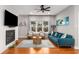 Living room with fireplace, tv, and a blue couch, providing a comfortable setting at 501 Blackberry Ln, Canton, GA 30115