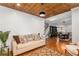 Bright living room with shiplap walls, wood ceiling and views to dining area at 501 Blackberry Ln, Canton, GA 30115
