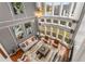 Bright living room featuring a soaring two-story window wall, neutral furniture, and stylish decor at 501 Blackberry Ln, Canton, GA 30115