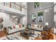 Spacious living room with tall ceilings, modern decor, and large windows offering natural light at 501 Blackberry Ln, Canton, GA 30115