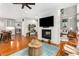 Open floor plan showing the dining room, living room, and kitchen, with a fireplace at 501 Blackberry Ln, Canton, GA 30115