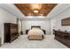 Large main bedroom with wooden tray ceiling, carpet floors, and plenty of natural light at 501 Blackberry Ln, Canton, GA 30115