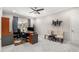 This office has carpet, a ceiling fan, curtains, and an office setup at 501 Blackberry Ln, Canton, GA 30115