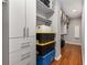 Organized walk-in closet with custom shelving and hardwood floors at 501 Blackberry Ln, Canton, GA 30115