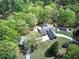 Bird's eye view of home with brick exterior, mature trees, and swimming pool at 5894 Highway 20 Ne, Cartersville, GA 30121