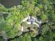 Beautiful aerial shot of property boasting mature trees, a private drive, and a backyard pool at 5894 Highway 20 Ne, Cartersville, GA 30121