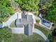 Overhead view of a home with an expansive driveway, outdoor deck, and sparkling in-ground pool at 5894 Highway 20 Ne, Cartersville, GA 30121