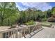 Backyard view from deck with a large lush yard, fire pit, and an outdoor lounge area at 5894 Highway 20 Ne, Cartersville, GA 30121
