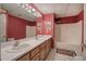A stylish bathroom features a double sink vanity and a tub-shower combination at 5894 Highway 20 Ne, Cartersville, GA 30121