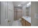 Cozy bathroom with tile floor, vanity with white countertop, and shower with curtain at 5894 Highway 20 Ne, Cartersville, GA 30121