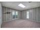 Cozy bedroom featuring unique wallpaper and a large window with natural light, plus outdoor views at 5894 Highway 20 Ne, Cartersville, GA 30121