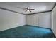 Large bedroom with neutral walls, blue carpet, and large closet space at 5894 Highway 20 Ne, Cartersville, GA 30121