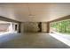 Spacious carport with multiple doors and high ceilings offers ample parking and shelter from the elements at 5894 Highway 20 Ne, Cartersville, GA 30121