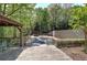 A wooden deck with an outdoor seating area and a gazebo overlooking the backyard at 5894 Highway 20 Ne, Cartersville, GA 30121
