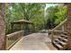 Wooden deck featuring an outdoor gazebo and a staircase leading to the backyard at 5894 Highway 20 Ne, Cartersville, GA 30121