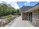 Brick house featuring a spacious deck overlooking a serene backyard with lush landscaping at 5894 Highway 20 Ne, Cartersville, GA 30121