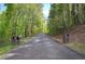 Private driveway entrance with brick pillars and custom signage adds character and charm to the property at 5894 Highway 20 Ne, Cartersville, GA 30121