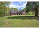 Charming brick home with a well-manicured lawn and mature trees, perfect for enjoying the outdoors at 5894 Highway 20 Ne, Cartersville, GA 30121