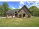 Well-manicured lawn and brick accents highlight this home's inviting exterior, perfect for enjoying the outdoors at 5894 Highway 20 Ne, Cartersville, GA 30121