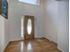 Bright foyer featuring a wooden front door with sidelights and beautiful hardwood flooring at 5894 Highway 20 Ne, Cartersville, GA 30121
