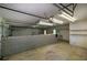 Spacious garage interior featuring a block wall, overhead lighting, and ample storage space at 5894 Highway 20 Ne, Cartersville, GA 30121