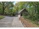 Three-car detached garage with brick exterior and ample parking space at 5894 Highway 20 Ne, Cartersville, GA 30121