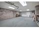 Large garage featuring ample storage space, cabinets and a workbench for projects at 5894 Highway 20 Ne, Cartersville, GA 30121