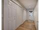Hallway with multiple storage closets and access to the home's entryway at 5894 Highway 20 Ne, Cartersville, GA 30121