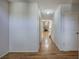 Inviting hallway with gleaming hardwood floors leading to a spacious living area with a fireplace at 5894 Highway 20 Ne, Cartersville, GA 30121