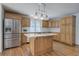 Kitchen with stainless steel refrigerator, central island and white countertops at 5894 Highway 20 Ne, Cartersville, GA 30121