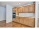 A kitchen featuring stainless steel double ovens and light wood cabinetry at 5894 Highway 20 Ne, Cartersville, GA 30121