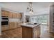 Kitchen featuring island cooktop, stainless steel appliances, and access to a great room at 5894 Highway 20 Ne, Cartersville, GA 30121
