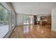 Bright living area adjacent to kitchen with hardwood floors, leading to an outdoor deck at 5894 Highway 20 Ne, Cartersville, GA 30121