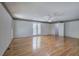 Hardwood flooring in this open-concept living room with ample natural light at 5894 Highway 20 Ne, Cartersville, GA 30121