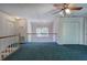 This cozy loft area features a ceiling fan and overlooks a bright window, perfect for relaxation and quiet enjoyment at 5894 Highway 20 Ne, Cartersville, GA 30121