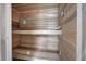 A home cedar sauna with wooden benches and a thermometer, offering a relaxing experience at 5894 Highway 20 Ne, Cartersville, GA 30121