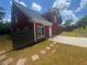 Charming two-story home featuring a fenced yard and a beautiful stone walkway and stone patio at 4505 Lakefield Bnd, Berkeley Lake, GA 30096