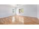 Spacious bedroom features wood floors, tray ceiling and two large windows at 4505 Lakefield Bnd, Berkeley Lake, GA 30096