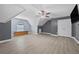 Bedroom with hardwood floors, a ceiling fan, neutral paint and built in storage at 4505 Lakefield Bnd, Berkeley Lake, GA 30096